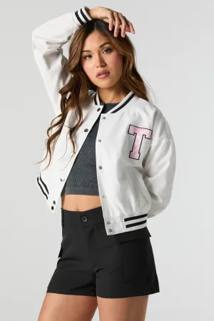 Blouson de style universitaire en nylon avec motif brodé en sergé